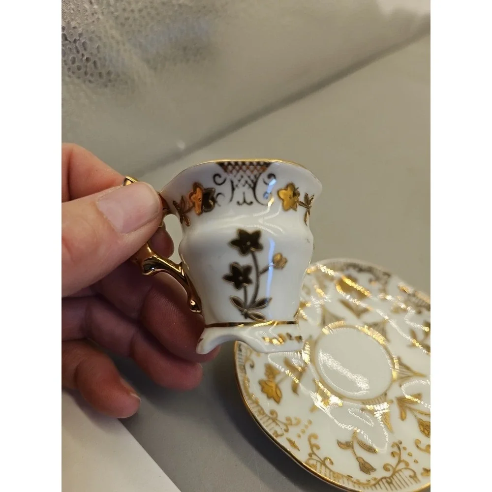Vtg Souvenir Bone‎ China Miniature Tea Cup & Saucer, Gold on White Floral